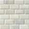 a close up of a white brick wall