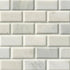 a close up of a white brick wall