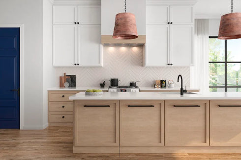 a kitchen with white cabinets and a blue door