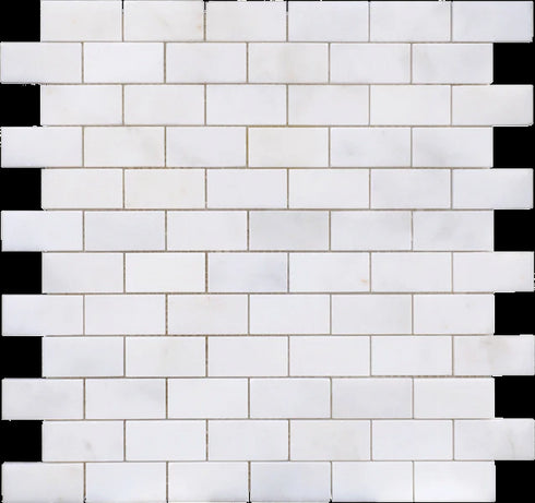 a white brick wall with white tiles