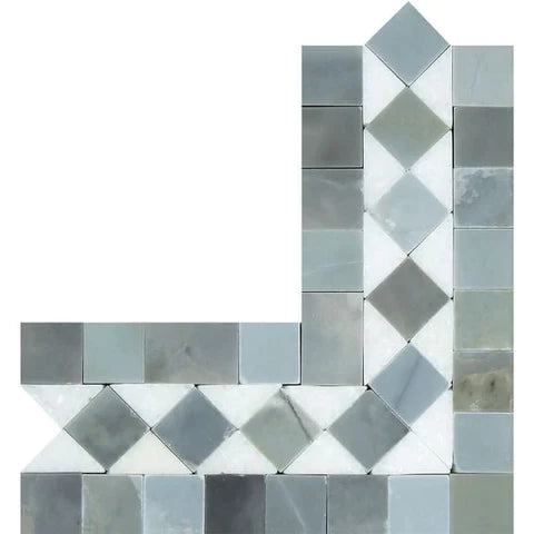 a white and grey mosaic tile wall