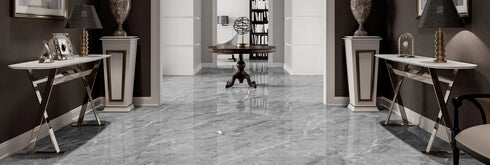 a long hallway with a marble floor and walls